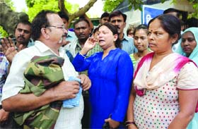 Family members of the 17 policemen, who were awarded life term in a fake encounter in Dehradun in 2009, at Tis Hazari Court in New Delhi on Monday