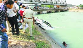 A car being retrieved from the Bhakra canal in Ropar on Monday.