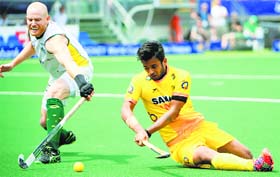 Australias Rob Hammond and Indias Manpreet Singh vie for the ball during their match on Monday.