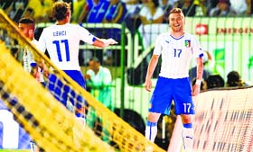 Italys Ciro Immobile (R) is all smiles after scoring during a friendly match between Fluminense and Italy.
