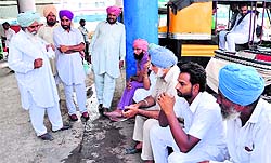 Farmers wait for labourers at the railway station in Bathinda on Tuesday