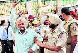 Farmers protest against the arrest of their leaders outside the IGPs office in Bathinda on Tuesday