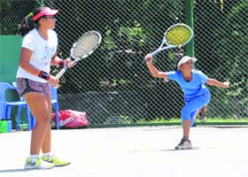 A player returns a shot during a tennis championship at the CLTA courts in Sector 10, Chandigarh