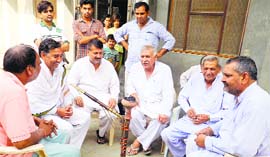 Members of the village committees at a meeting in Nahri village of Sonepat.