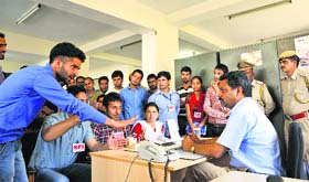 Activists of the SCA meet the chief warden in connection with demands of mess workers at Himachal Pradesh University in Shimla on Tuesday.