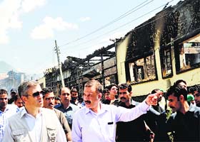 Chief Minister Omar Abdullah inspects the blaze site in Pahalgam on Tuesday