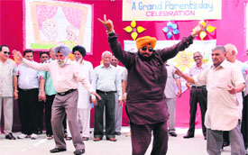 Tiny tots and grandparents (right) dance on a song during a function at CT Public School in Jalandhar.