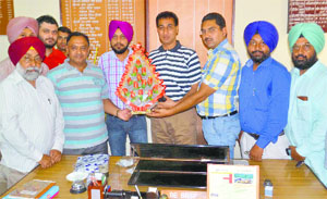 Office-bearers of the Anti-Copying Teachers Front welcome new District Education Officer (Secondary) Gurjot Singh (centre) in Ludhiana on Tuesday.