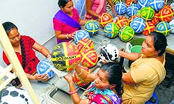Women working at a football-manufacturing factory in Jalandhar on Tuesday