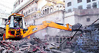  Workers of the Amritsar Improvement Trust raze a temple building to take possession of an area inside the Durgiana temple complex to beautify its surroundings