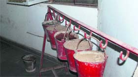 Containers filled with water and sand at the Mini-Secretariat building in Panchkula.