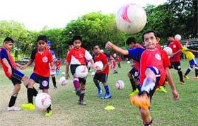 Children practice in a football camp at Government College, Sector 46, in Chandigarh, on Wednesday.