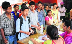 Students buy admission forms at a government school in Chandigarh on Wednesday.