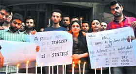 Students hold a candlelight march at the Student Centre, Panjab University, in Chandigarh on Wednesday.