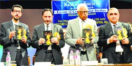 Governor NN Vohra releases a book at the international conference on Culture and Literature in Medieval Central Asia in University of Kashmir on Wednesday.