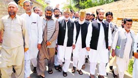 Hurriyat Conference leaders led by Syed Ali Geelani block the Srinagar airport road after the police did not allow them to hold a seminar in Srinagar on Wednesday.