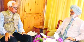 Governor NN Vohra with Jammu University Vice Chancellor Mohan Pal Singh Ishar at Raj Bhawan in Srinagar on Wednesday.