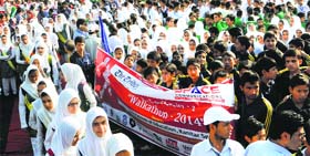 schoolchildren participate in the walkathon on the banks of the Dal Lake in Srinagar on Wednesday.