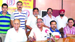 Members of the Wholesale Chemists Organisation address mediapersons in Jalandhar on Wednesday.