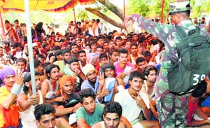 an Armyman instructs youths during a recruitment rally in Jalandhar on Wednesday.