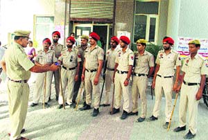 A police officer instructs his juniors outside the MC office