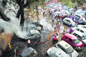 Fire being doused at a parking lot of Kapoor Hospital in Ludhiana