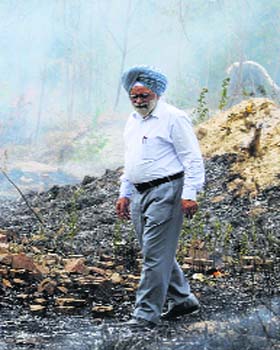 Firefighters in action at a showroom at Raikhey Cinema Chowk in Ludhiana on Wednesday