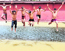 Youngsters dive in Sirhind canal to beat the heat in Bathinda on Thursday.