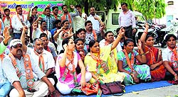 BJP activists hold a protest against rampant power cuts in Haridwar on Thursday