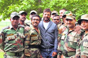 Bollywood actor Javed Jaffrey with Army jawans in Shopian district on Thursday where he is shooting for a Malayalam film Picket 43. 