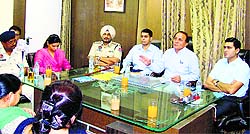 Ludhiana Deputy Commissioner Rajat Aggarwal (extreme right) has a discussion with government officials in Jagraon on Thursday
