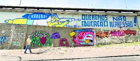 A graffiti depicting the World Cup mascot Fuleco, the Armadillo, pointing a rifle.