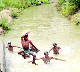 Children enjoy a dip in the canal