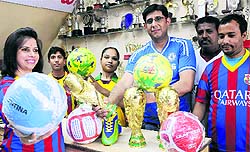 Replicas of the FIFA World Cup and footballs on display at a sports goods store in Sector 20, Chandigarh