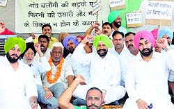 Balbir Singh Sidhu takes part in the protest at Balongi village in Mohali on Friday