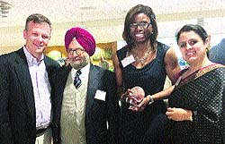Danisha Higgs of the Bahamas (with crystal globe in her hands) with Samarvirs father Gurpratap Sahi (in turban) and his sister Meenu Sahi (extreme right) after receiving the coveted trophy from Dr Lex McMillan (extreme left), president of Albright College, based in Reading, Pennsylvania, USA