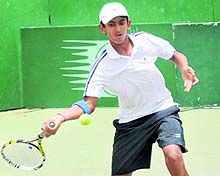 A player returns a shot during a match of the ATF Asian Ranking Under-14 Tennis Tournament in Chandigarh