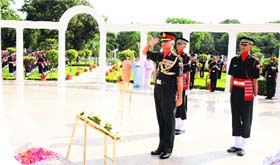 Lt Gen Manvendra Singh, Commandant, Indian Military Academy, lays a wreath at the war memorial in Dehradun on Friday.