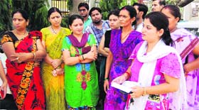 Women residents of Subhash Nagar submit a memorandum to officials regarding water shortage due to power cuts in Haridwar on Friday.