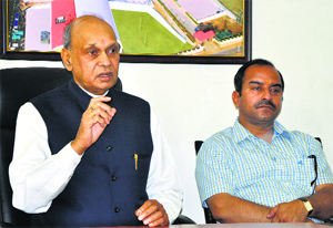 Former Chief Minister Prem Kumar Dhumal addresses mediapersons in Dharamsala on Friday.