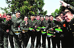 Newly commissioned officers of Afghanistan celebrate after the passing-out parade at the IMA in Dehradun on Saturday