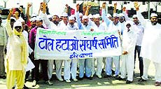 Villagers hold a demonstration at the Dighal toll booth in Jhajjar on Saturday