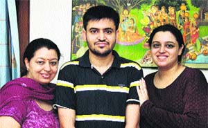 Raghoo Puri with his family members in Jalandhar on Saturday.