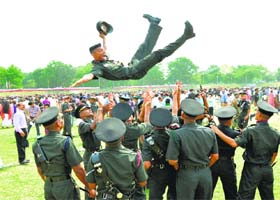 In high spirits: Gentlemen cadets of the Indian Military Academy (IMA) rejoice after the passing-out parade in Dehradun on Saturday