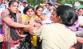 The police prevent activists of Inclusive Education Volunteers Union from blocking the GT Road in Bathinda on Saturday.