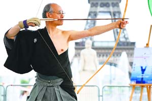 Japanese Kyudo "grand master" Sakuma takes part in a demonstration of Kyudo, a Japanese martial art form of archery, in Paris, ahead of the Kyudo World Championship which will be held in Paris on July 19 and 20