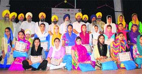Office-bearers of Akal Purakh Ki Fauj pose with students who participated in Sirjana Gurmat camp in Amritsar.