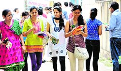 Students come out of a centre after appearing for CET at Panjab University on Sunday