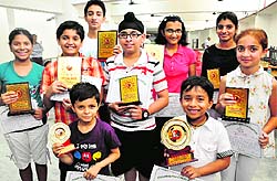 Winners of Chandigarh Under-15 and Under 7 Open and Girl Chess Championship 2014, with their trophies at St. Xavierss Sr. Sec. School, Sector 44, Chandigarh, on Sunday