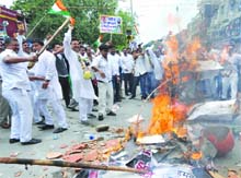 Congress activists continue their protest over the issue of power and water shortages, at Karol Bagh in New Delhi on Sunday.